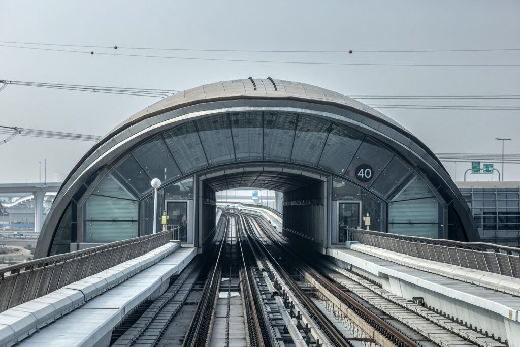 A view of the sleek design of a Dubai Metro tunnel entrance, showcasing modern transportation infrastructure.