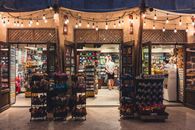 Illuminated souvenir shop in Dubai showcasing vibrant toys and gifts. A lively glimpse into local culture.