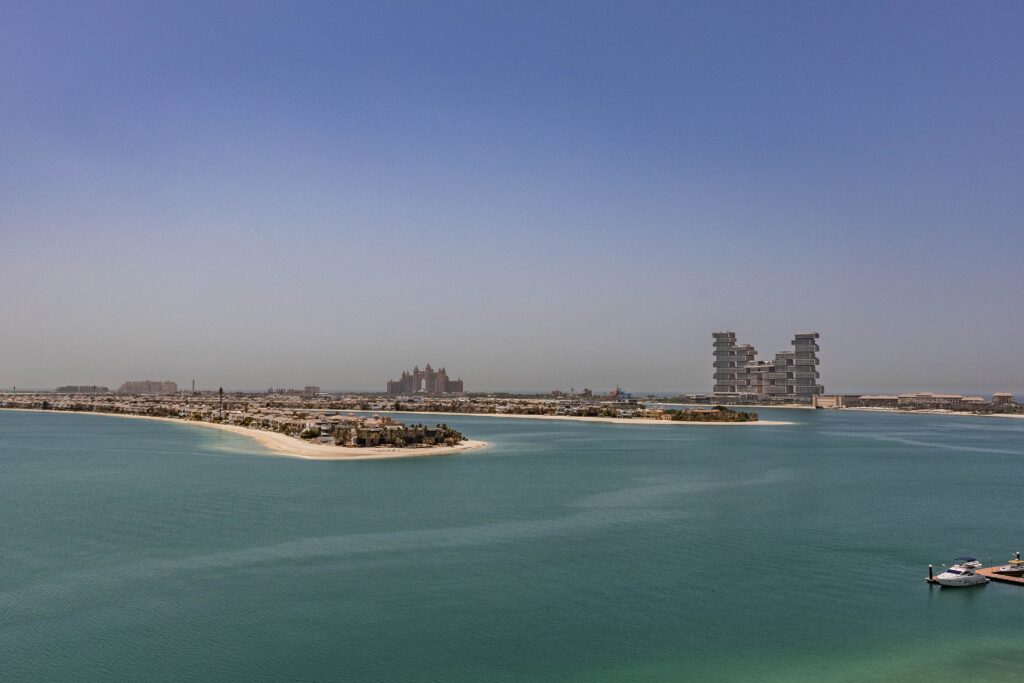 Aerial view of Palm Jumeirah in Dubai showcasing modern architecture and serene waters.