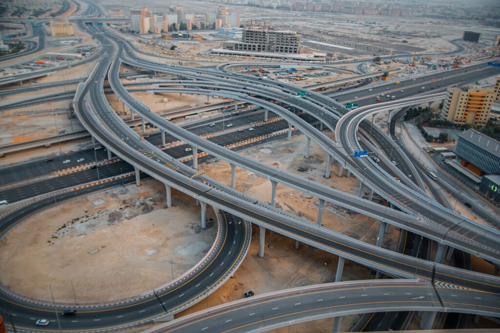 Explore the intricate design of Dubai's highway interchange from an aerial perspective.